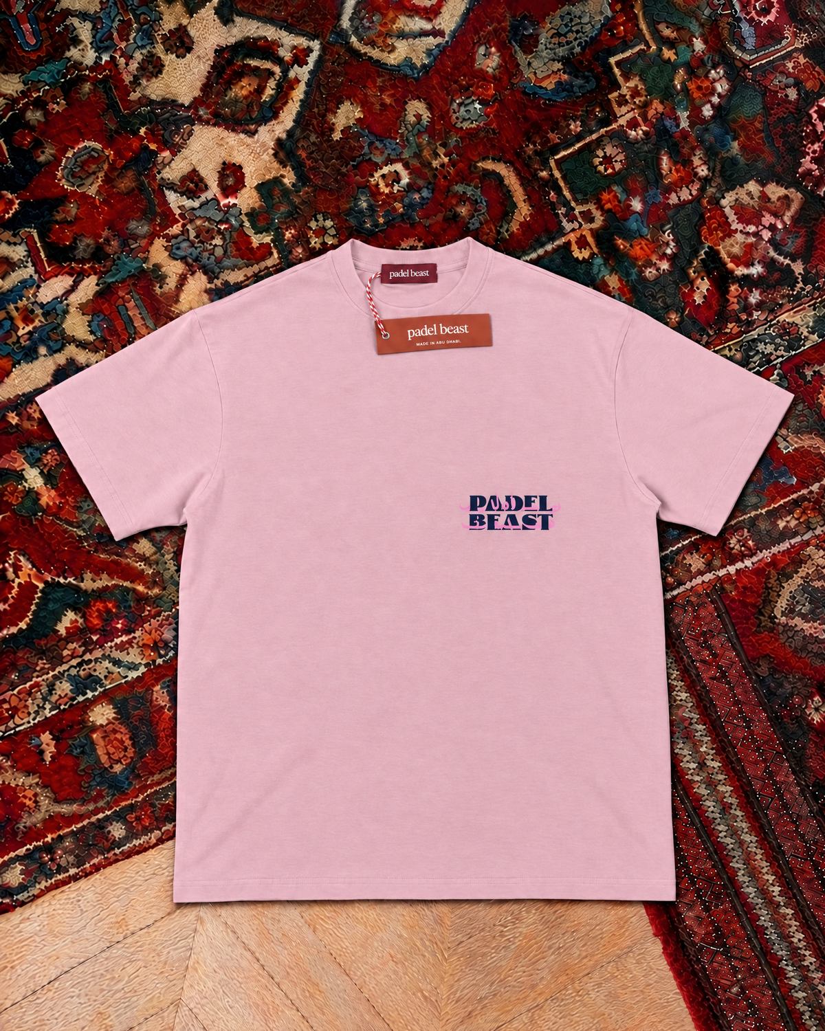 Padel Beast Arabic wordmark, pink t-shirt with navy print, front