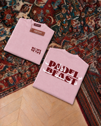 Padel Beast Arabic wordmark, pink t-shirt with red and white print, front and back