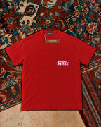 Padel Beast Arabic wordmark, red t-shirt with white and pink print, front