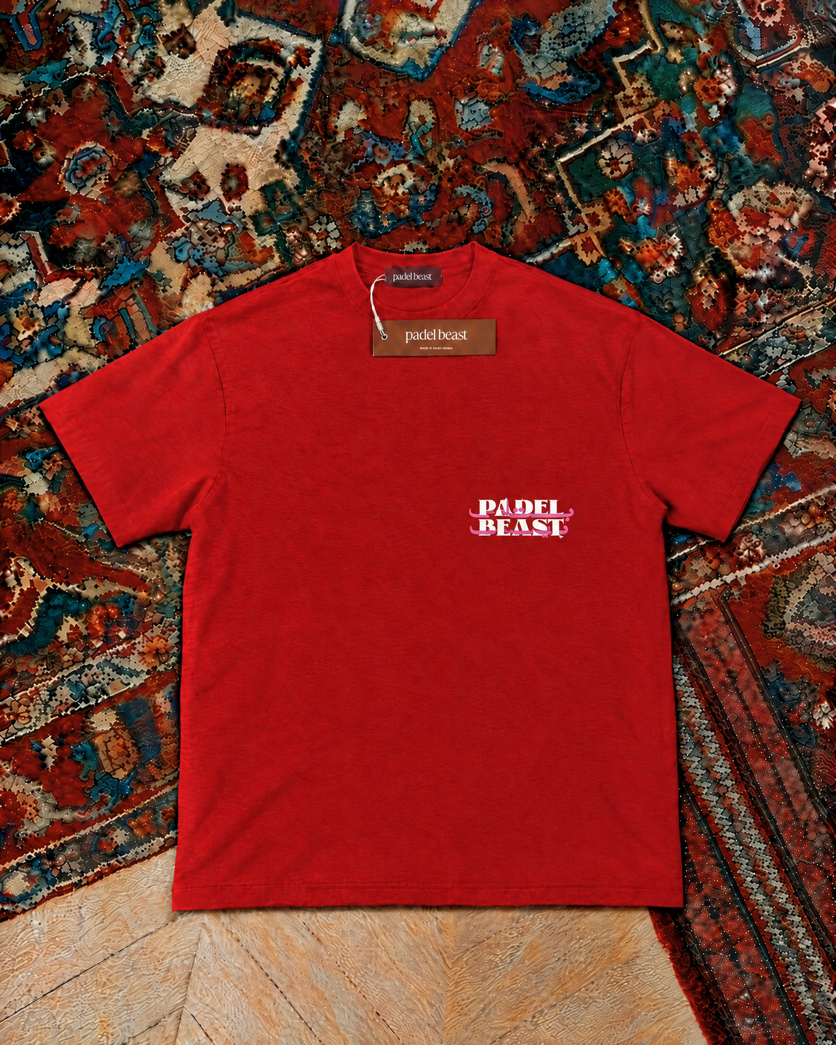 Padel Beast Arabic wordmark, red t-shirt with white and pink print, front