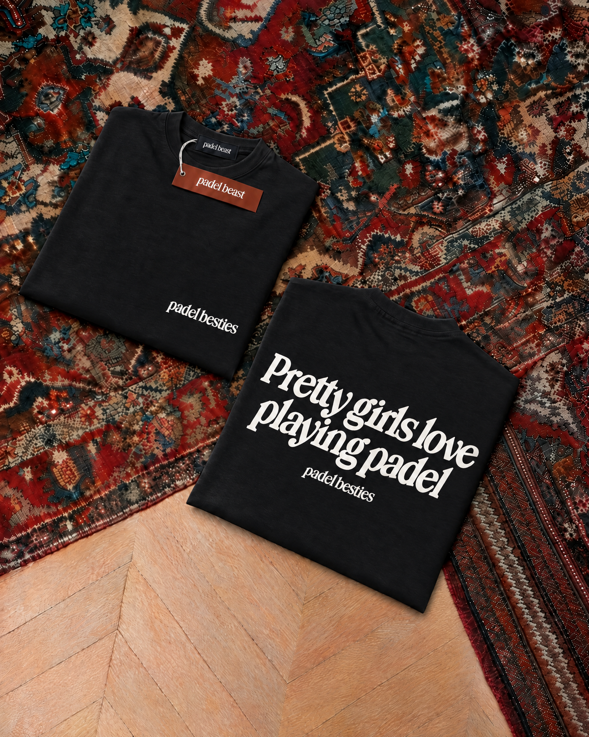 Padel Pretty Girls tee in black, folded front and back