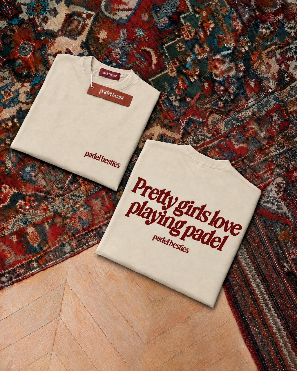 Padel Pretty Girls tee in cream with oxblood print, folded front and back