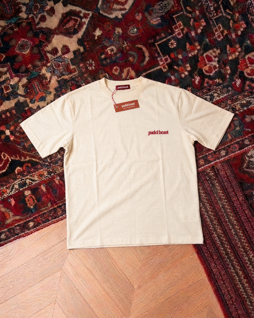 Padel Stole All My Money cream tee front, new neck label and hangtag