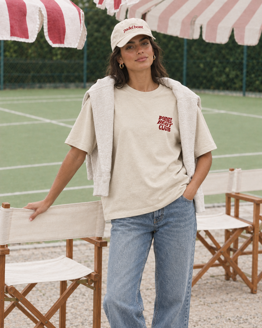 Padel Beast Club cream tee on a woman, front, at the padel club