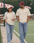 Couple wearing the Pretty girls love playing padel cream tee