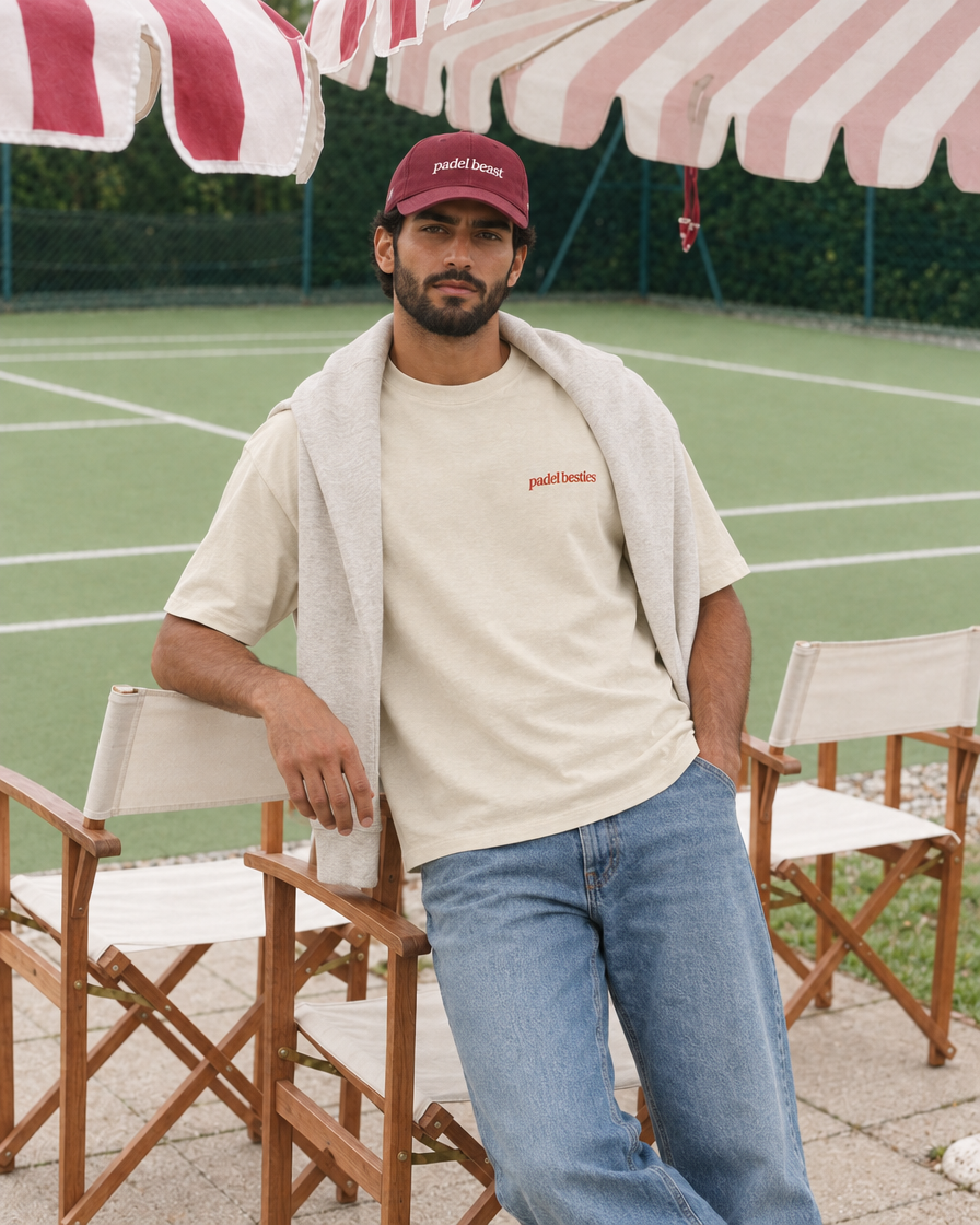 Pretty girls love playing padel cream tee on a man, front