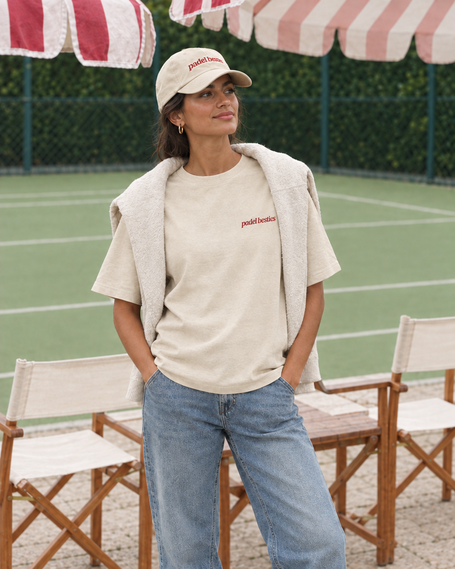 Pretty girls love playing padel cream tee on a woman, front