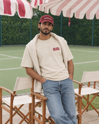 Padel Beast Arabic cream tee on a man, front