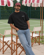 Padel stole all my money black tee on a man, front
