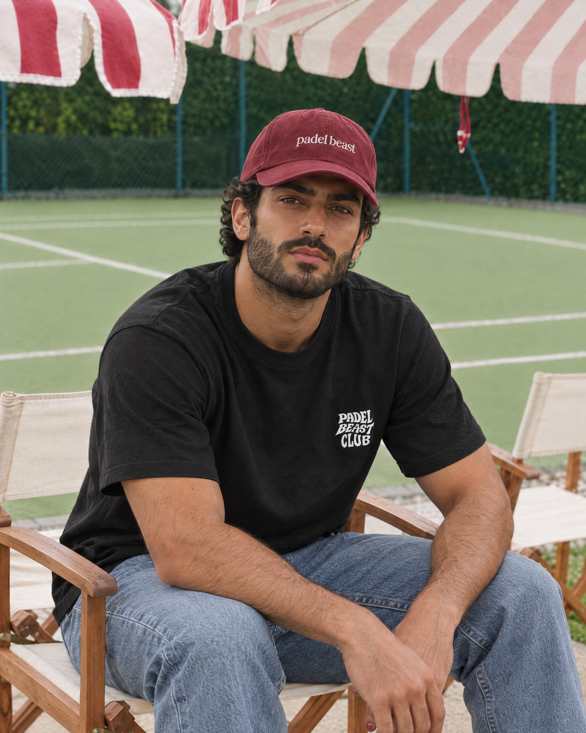 Padel Beast red cap worn courtside at the padel club